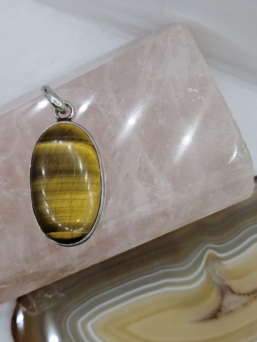 Colgantes de plata con mineral. Ojo de tigre