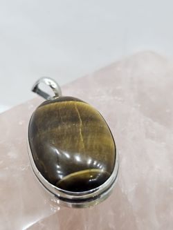 Colgantes de plata con mineral. Ojo de tigre