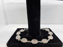 Pulsera de plata con mineral. Cuarzo rosa ovalado